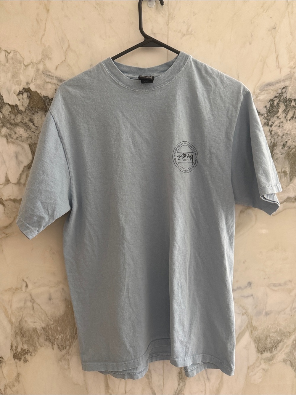 Stussy Light Blue Short Sleeve Crewneck T‑Shirt with Chest Emblem